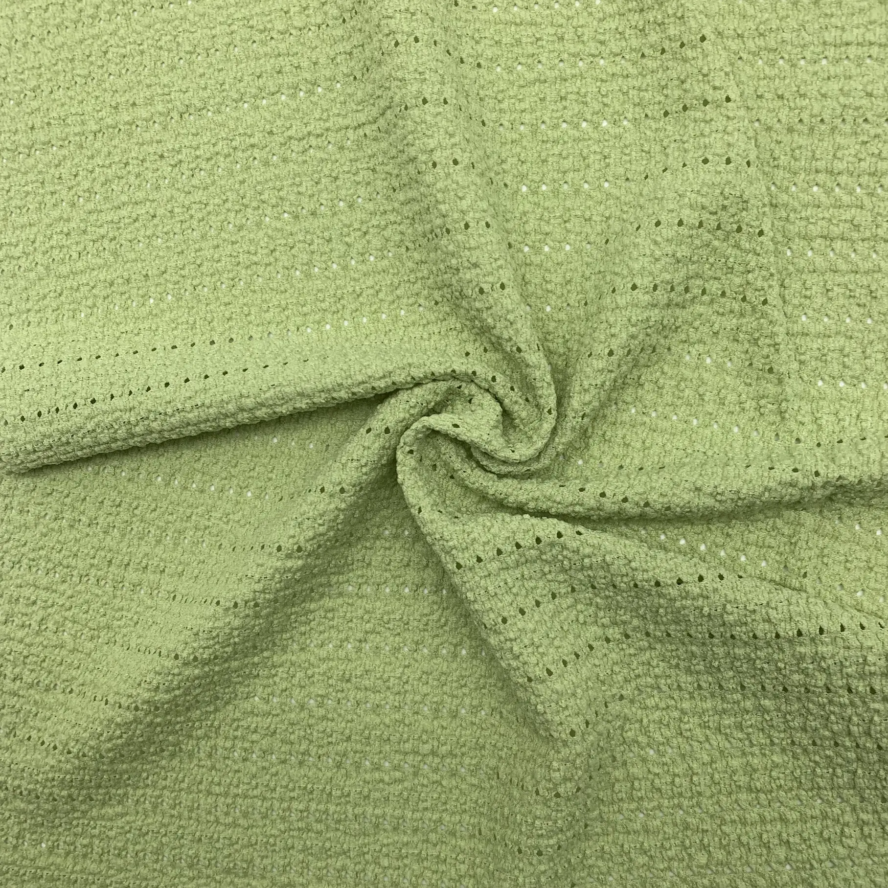 Lace crepe fabric full view – hollow-out textured surface and soft drape