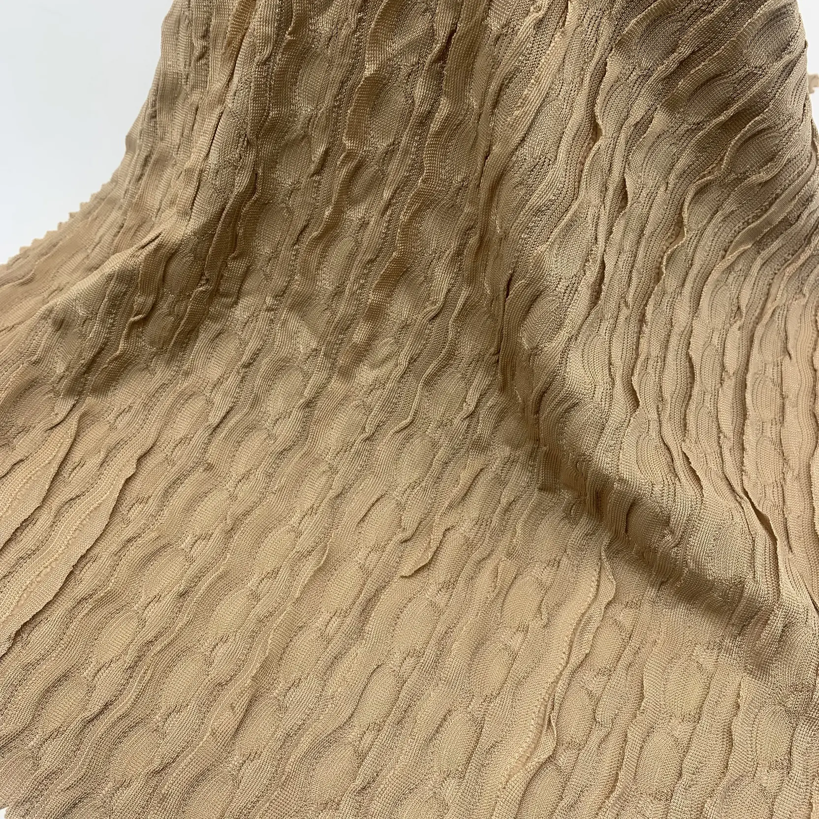 Lace crepe knit fabric full view – rib ruffled texture and soft drape