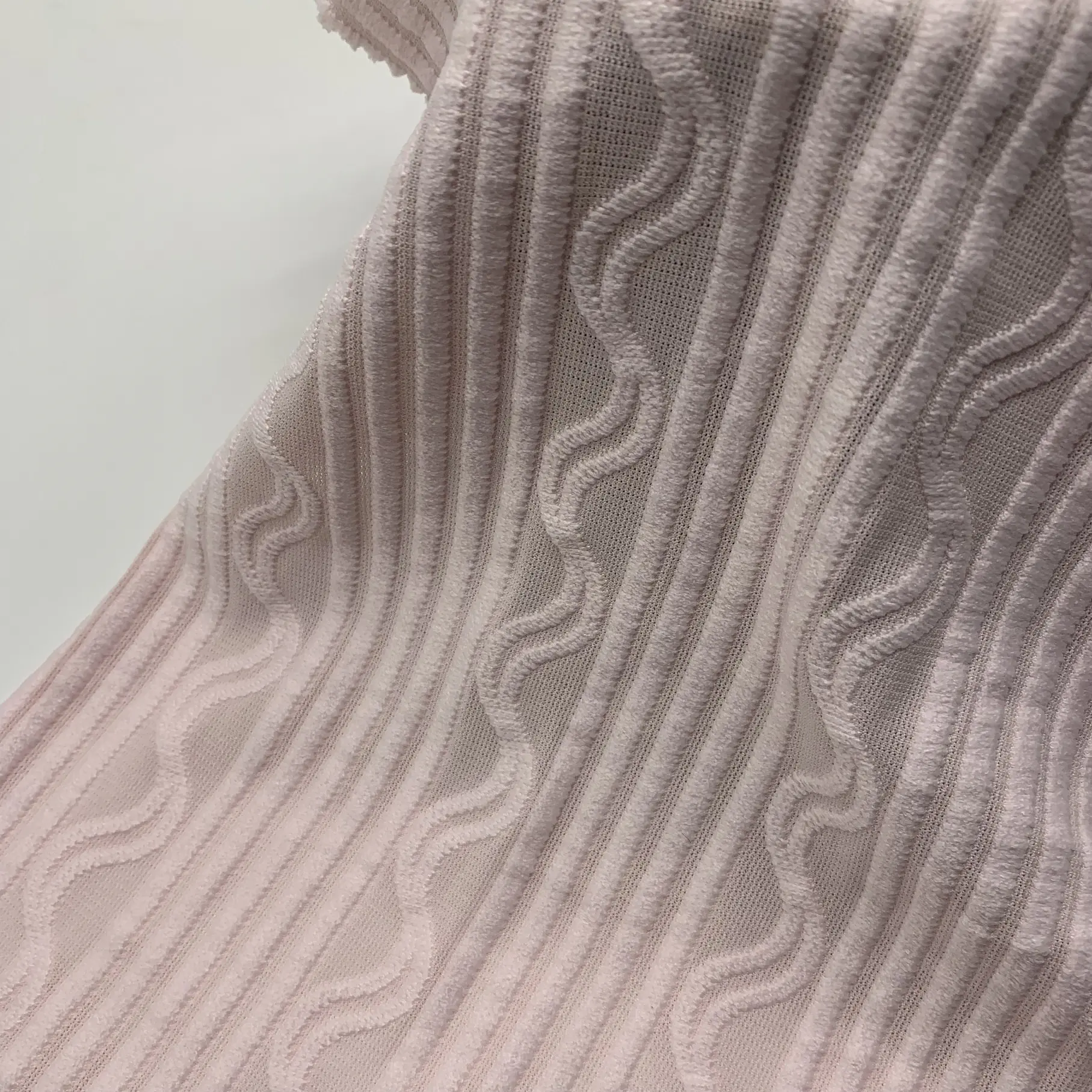 Jacquard lace crepe fabric full view – pink embossed pattern and soft drape