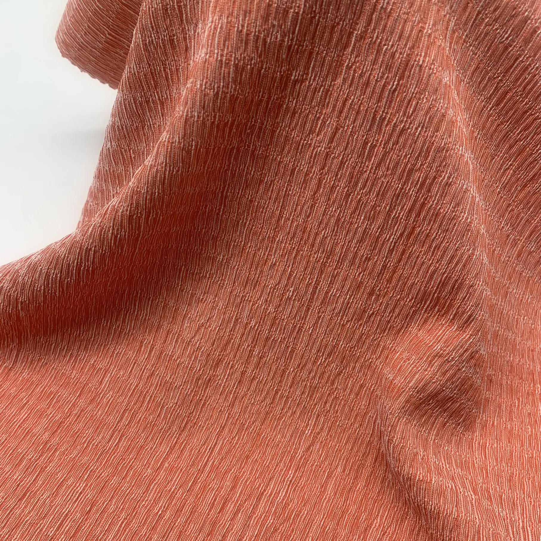 Stretch crepe knit fabric full view – textured crinkled surface and soft drape
